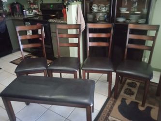 Brown wood four chair with bench dining table set