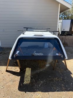 White Truck Camper Shell with Roof Rack