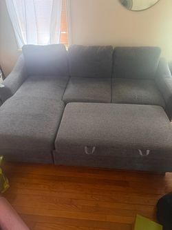 Gray sectional with storage and charging ports