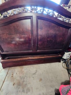 Dark Wood Bed Headboard with Ornate Scrollwork