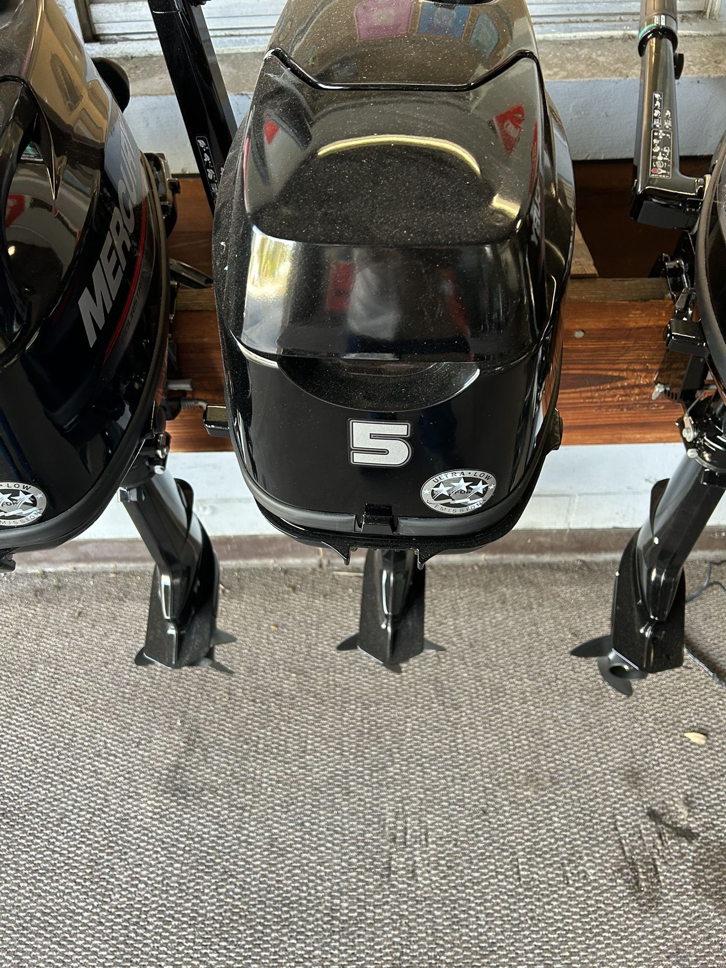 Small Mercury tiller handle outboards
