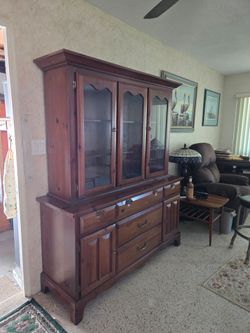 2 piece Brown hutch with stackable cabinet glass doors