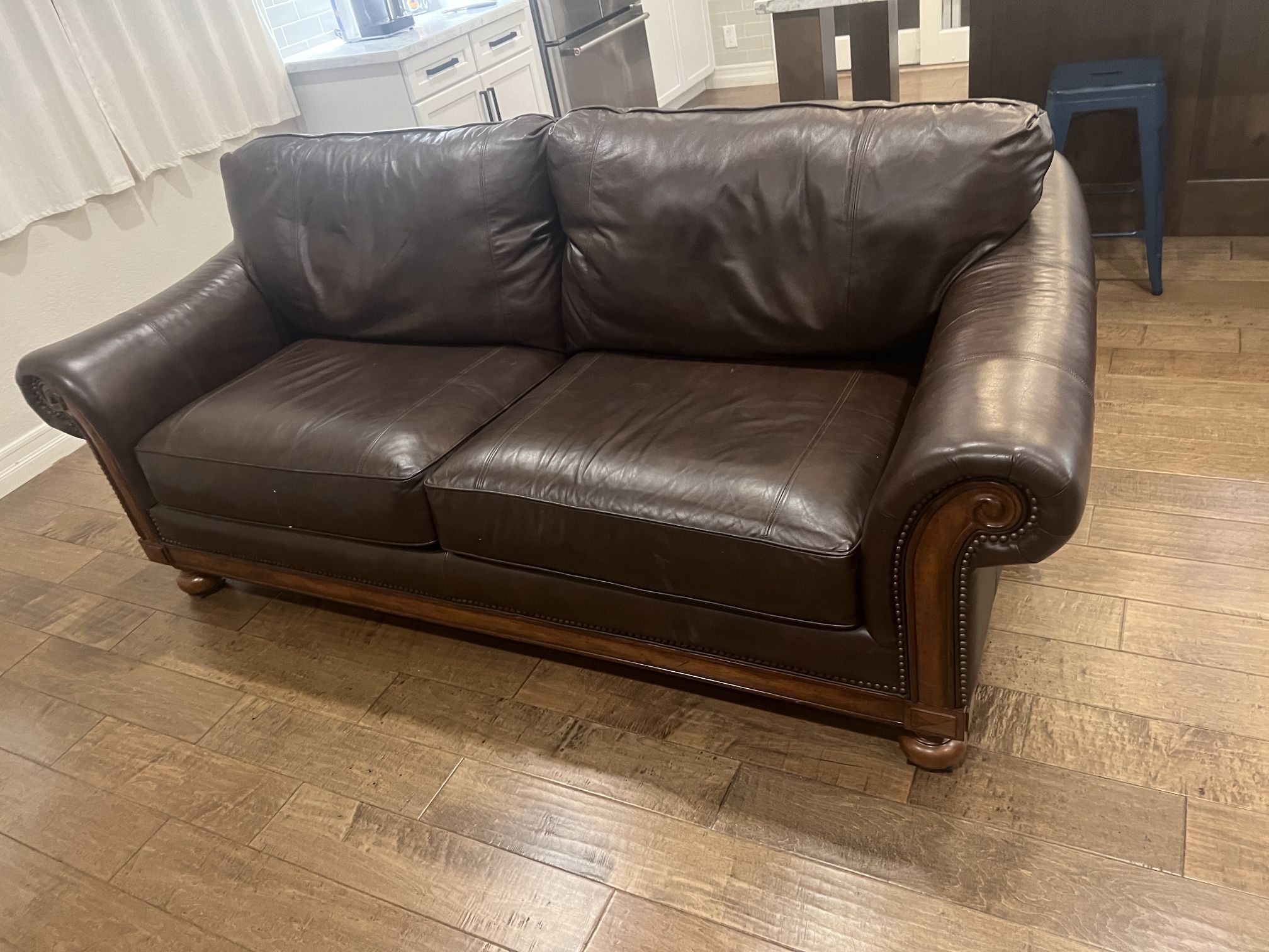 Beautiful brown leather sofa, and loveseat