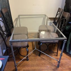 Iron Glass top Table And Four Upholstered chairs
