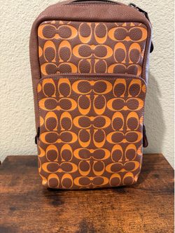 Coach Graham Pack in Signature Pebble Leather and Orange Monogram