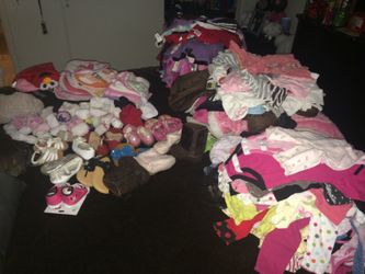 Baby girl clothes, shoes, sandals, socks, hats, aprons, and towels.