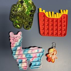 Set Of Pop It Fidget Toys. Llama/Alpaca, French Fries, Among Us Spaceman. French fries, among us space man and lama/alpaca pop it toys. Great for anxi