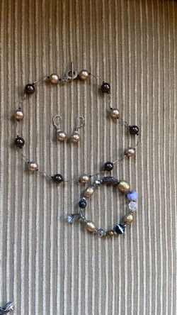 Costume jewelry bronze necklace, earrings and bracelet
