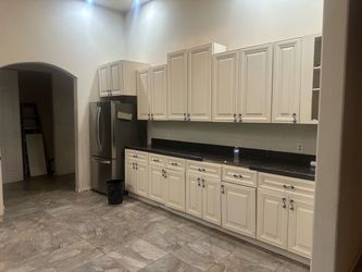 White Kitchen Cabinet Set with Dark Countertop