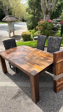 Wood table and wicker chairs
