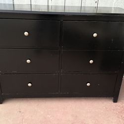 Black long dresser with six drawers in good condition all drawers open just fine