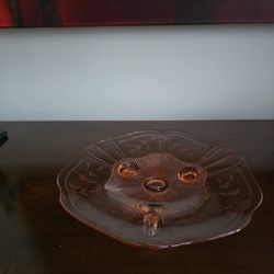 Pink depression glass three-footed serving plate with scalloped edge and ribbed center, Lancaster Glass Company
