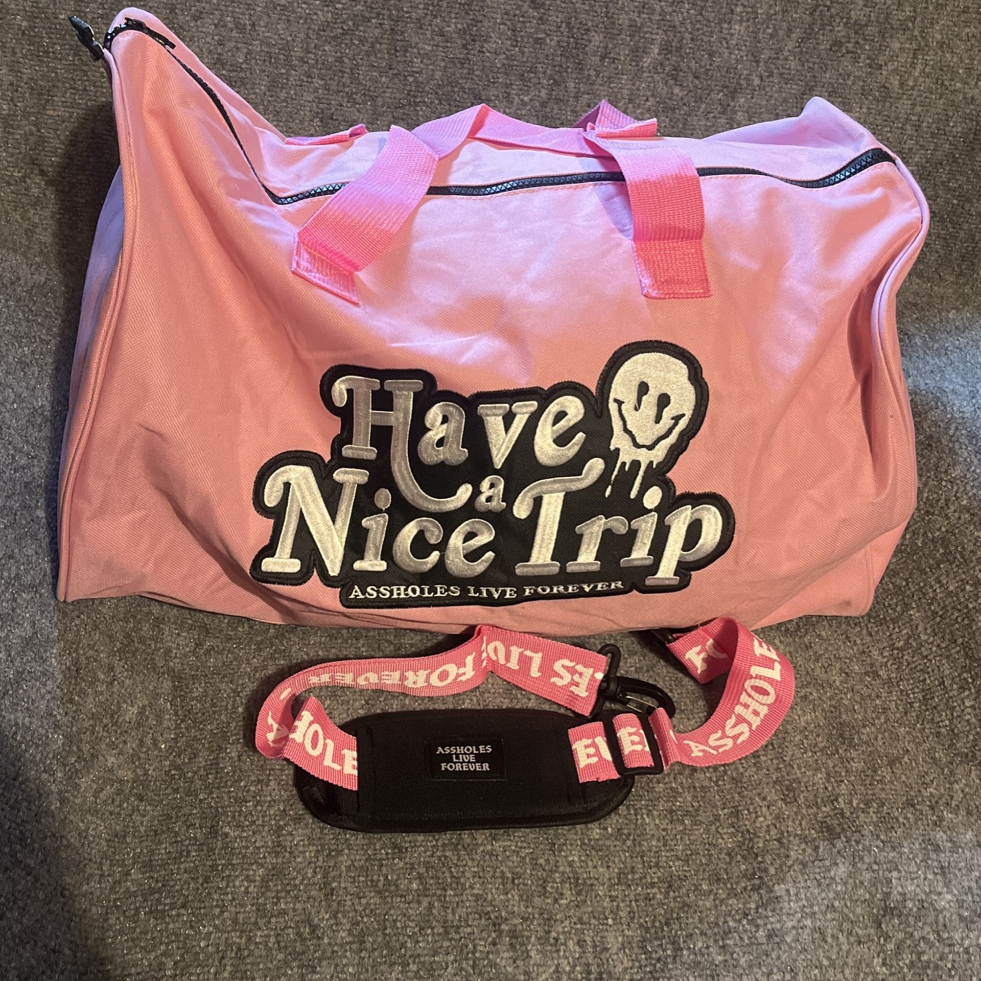 Brand New: Assholes Live Forever (ALF) Have A Nice Trip Pink Duffle Bag With Shoulder Strap