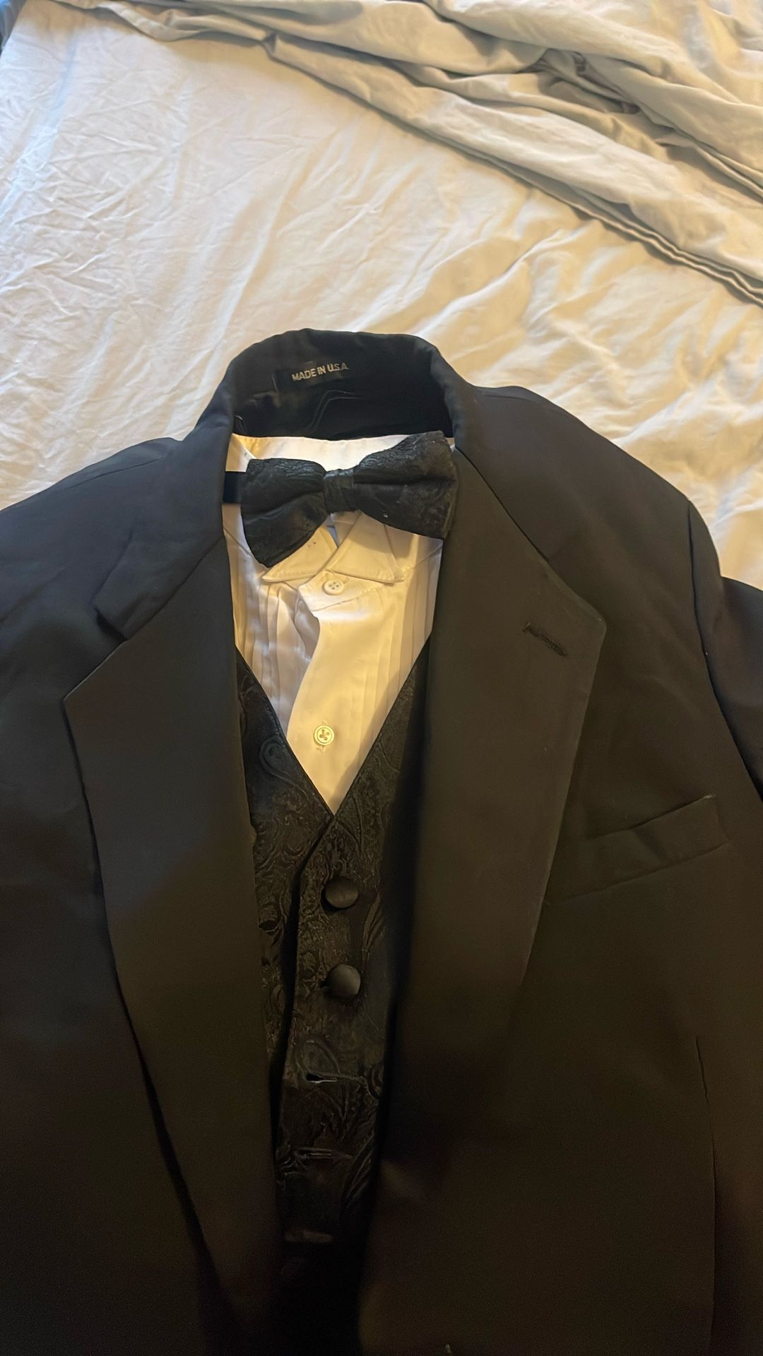 Black Tuxedo With Paisley Bow Tie And Paisley Vest