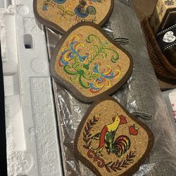 cork and wood folk art trivets, likely from the 1960s