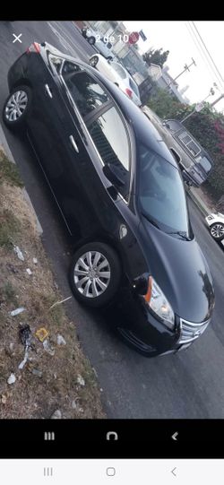 Nissan  2013. Titulo Limpio  con 100mil. Millas. Originales