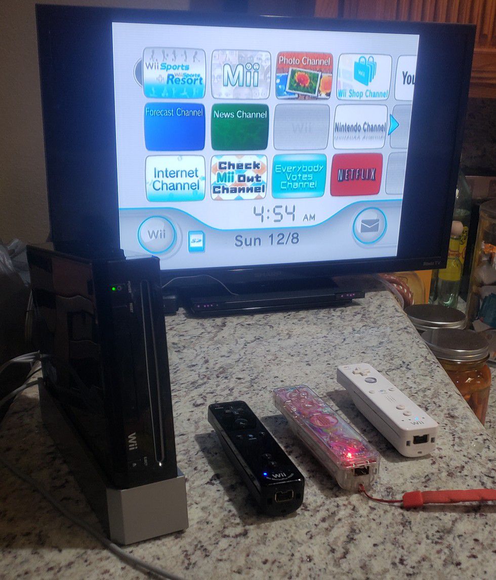 Nintendo wii with 3 remotes and games that u see in the pic.. I also have more popular games but those r sold separately