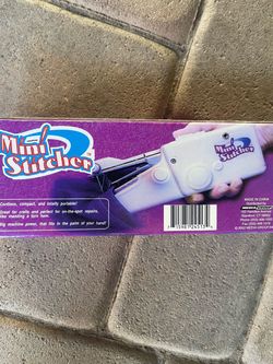 Hand held sewing machine