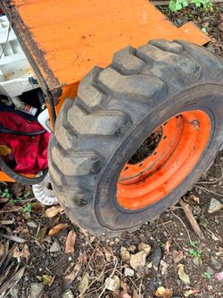Backhoe tire in rims Backhoe tire in rims