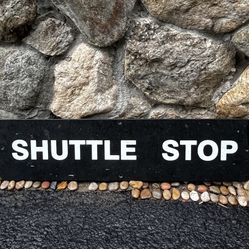 SHUTTLE STOP sign