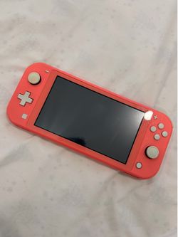 Nintendo Switch Lite Coral + Charger, Case & Stand – Good Condition