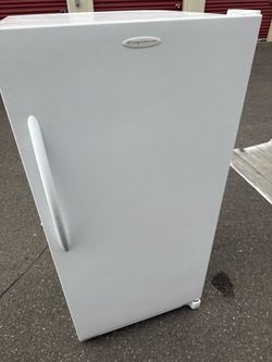 Upright glossy white freezer
