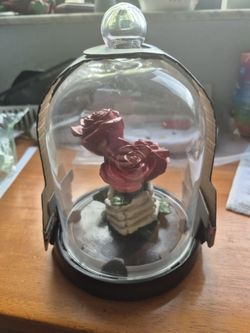 Under The Dome Skeleton Hand Holding Roses 