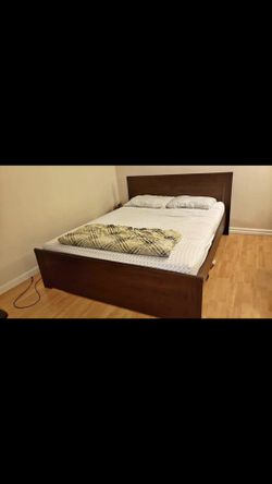 Queen bed frame like new with slats