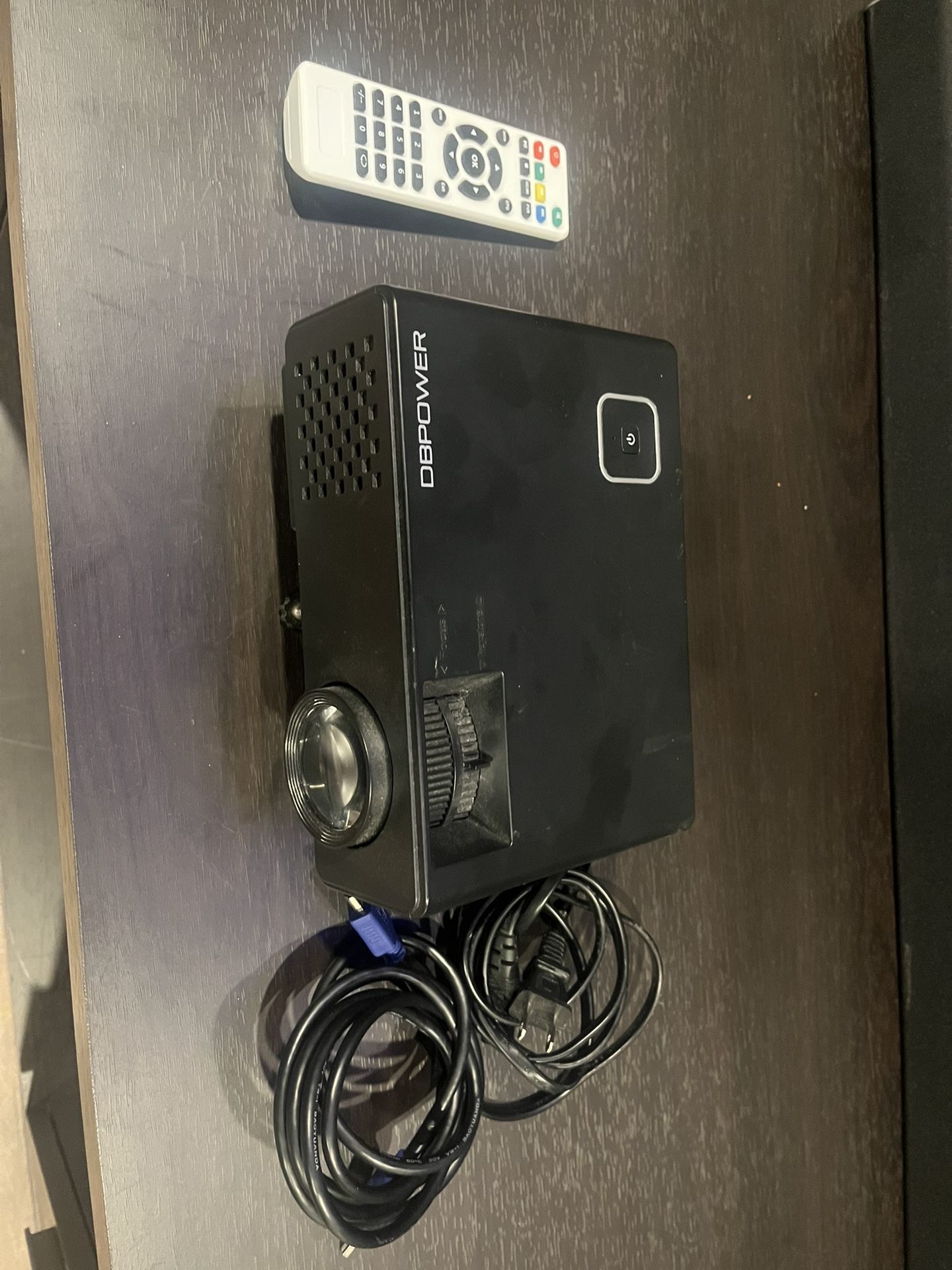 Projector with retractable projector screen.