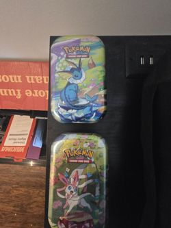 Unopened Pokémon tins