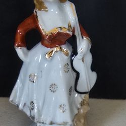 VTG Porcelain figurine lady in blue bonnet holding violin / chelo