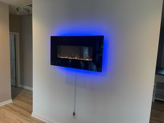 Like new electric wall fireplace