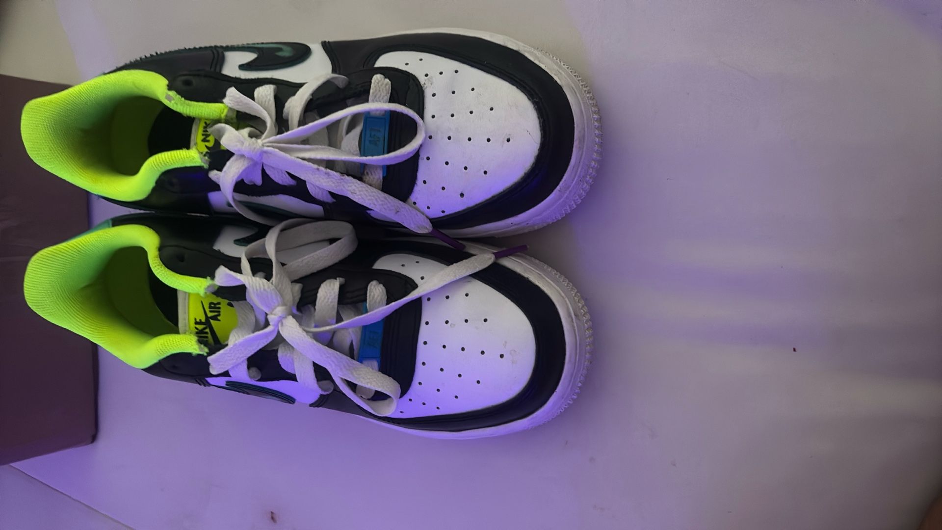 Nike Air Force 1 LV8 GS 'Graffiti' sneakers in a White, Laser Blue, Volt, and Black colorway