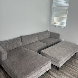 Grey “L Shape” Living Room Couch With Attachment