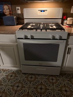 Gas range and overhead microwave