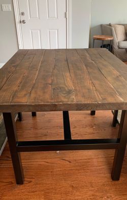 Rustic natural metal and reclaimed wood dining table