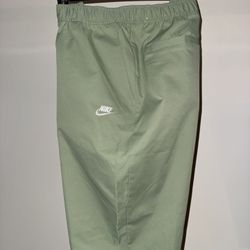 Nike Club Men's Woven Tapered Leg Pants in Oil Green