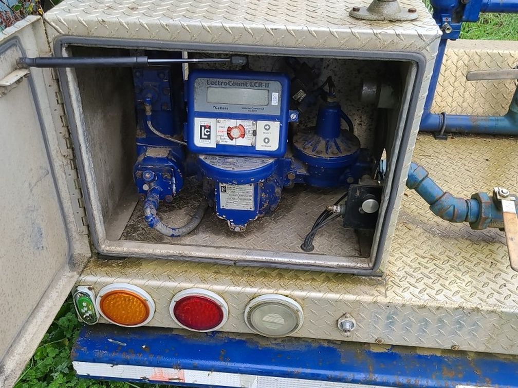 Rear End Of A Propane Truck With Digital Counter And Reels And Hose