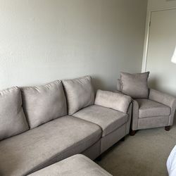 Set of couch , armchair and ottoman.  Gray coloured