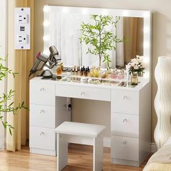 Dressing table with illuminated mirror
