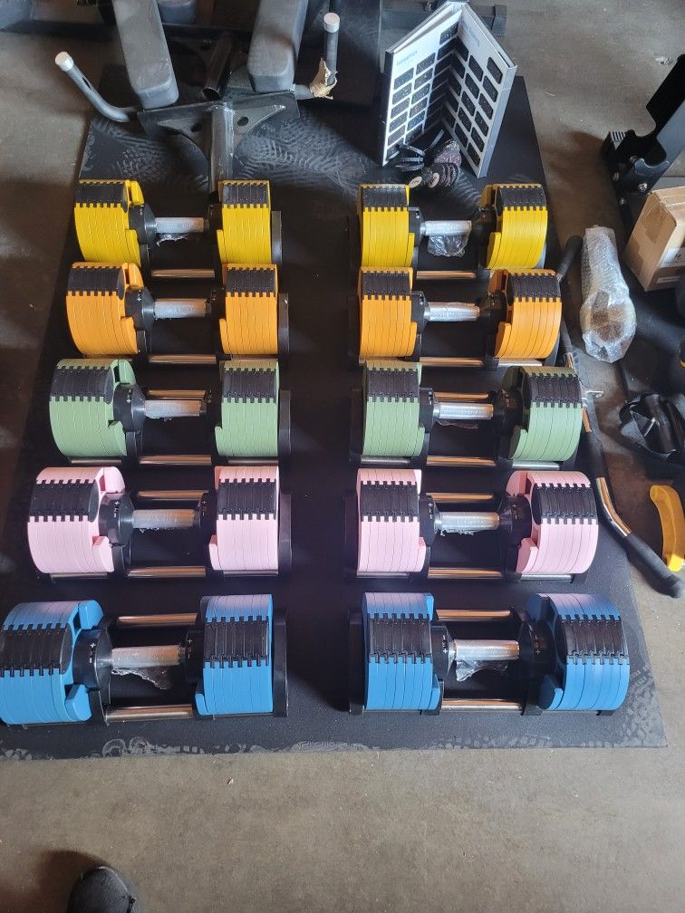 A Multi-Color Adjustable Dumbbell pair From 5 To 70lbs $500. I'll include stand for a total of $550.