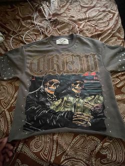 Selling a 4-piece men’s streetwear bundle 🔥 Includes graphic tees and a button-up shirt with unique designs, all in good condition. They may be a lit