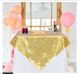 Gold Sequin Tablecloth 50x50 Inch Square

Sparkly 3mm stitched sequins and serged edges dress dessert cake and gift tables for weddings and gala recep