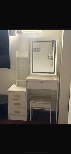 chest of drawers with mirror and chair