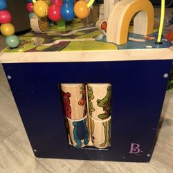 The item in the image is the B. toys Zany Zoo Wooden Activity Cube.  