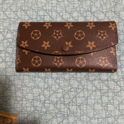 Louis Vuitton. Size 8 X 4.