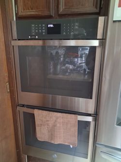Stainless steel double ovens smart replient barely used