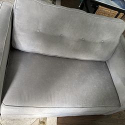 Pullout Couch, Table, Artwork, Rug, Chair 