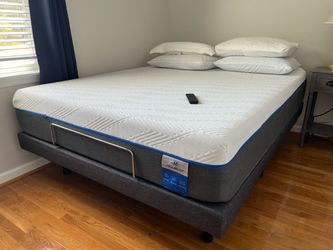 Queen size adjustable bed with mattress .