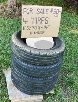 Four matching 14” Dunlop tires.